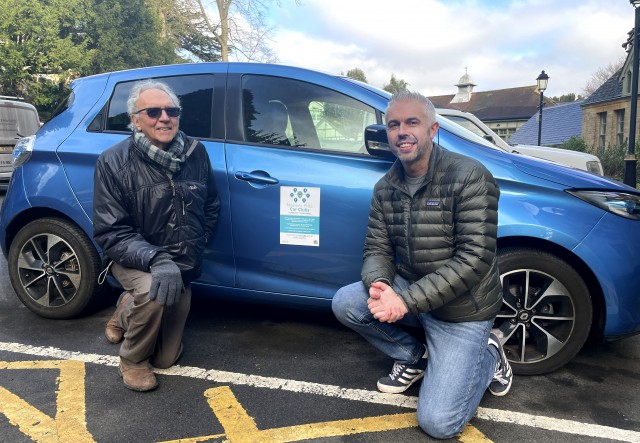 Pictured: Robin Coates, Co-founder of Malvern Hills Community Car Club, and Cllr Daniel Walton, Portfolio Holder for Economic Development and Tourism at Malvern Hills District Council, crouching by a car.